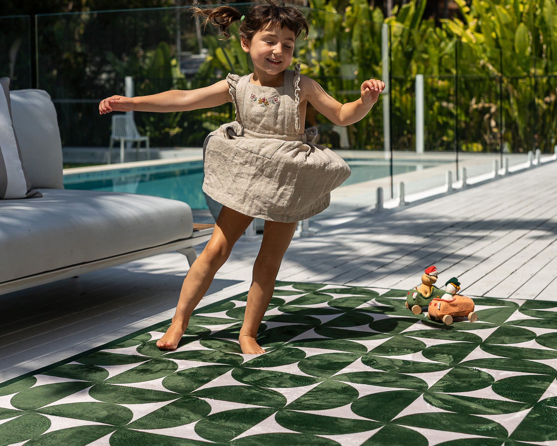 Modern mid-century baby floor mat – green and beige retro pattern styled in neutral home interior