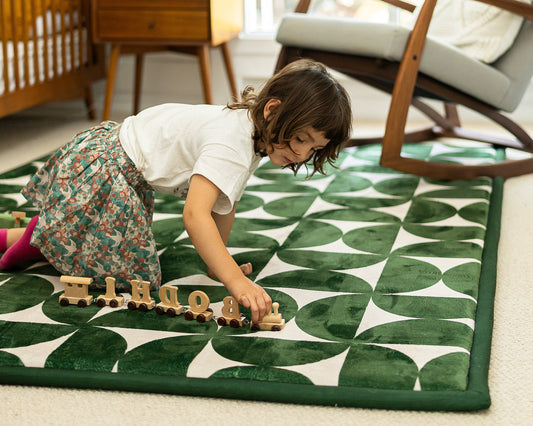 The Retro Arc Play Mat – dark green and beige mid-century modern baby play mat designed in Australia