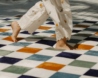 Modern gender-neutral baby play rug – reversible check tatami mat alternative in earthy green, blue and orange tones