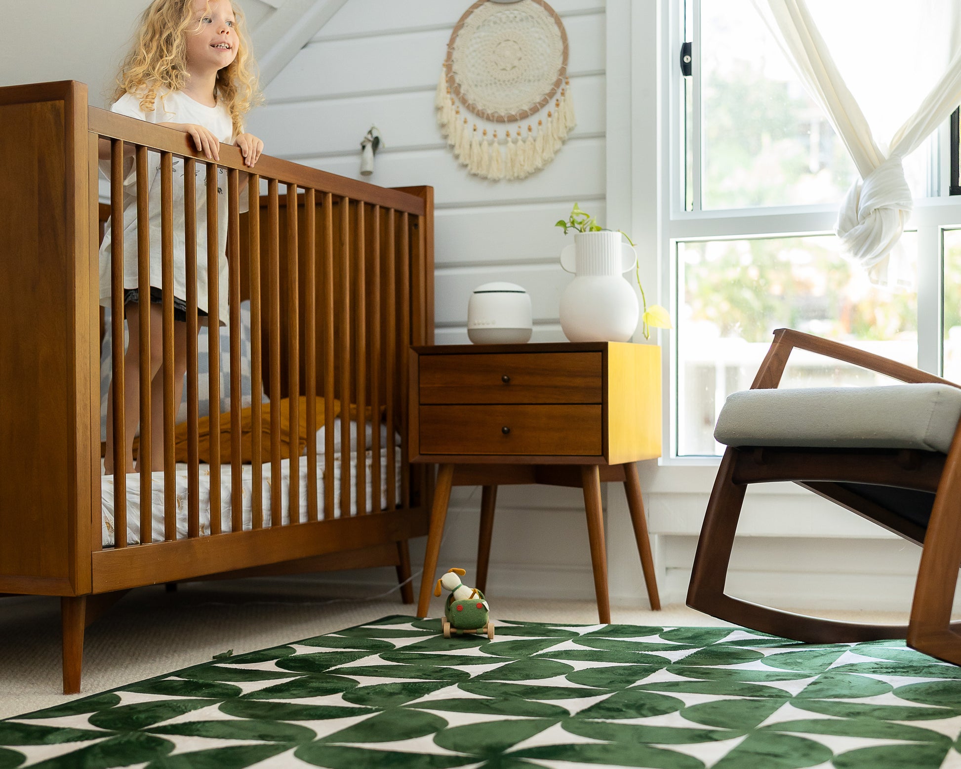 Modern mid-century baby floor mat – green and beige retro pattern styled in neutral home interior